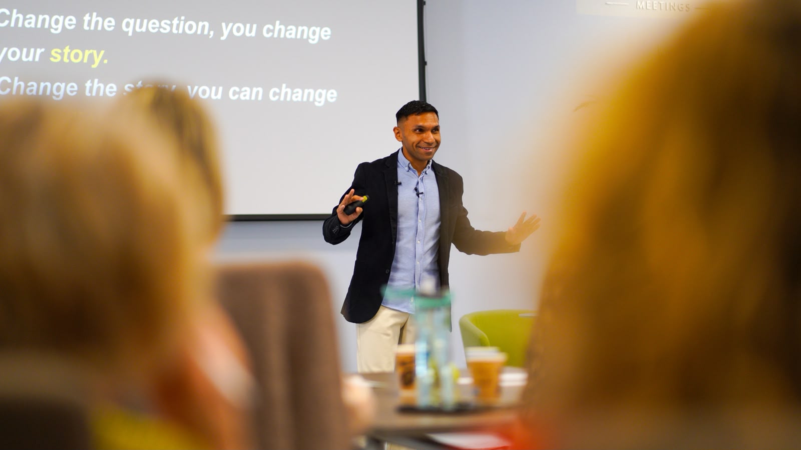 Mo Haque delivering the Absurd Hope keynote — Ask the Audacious