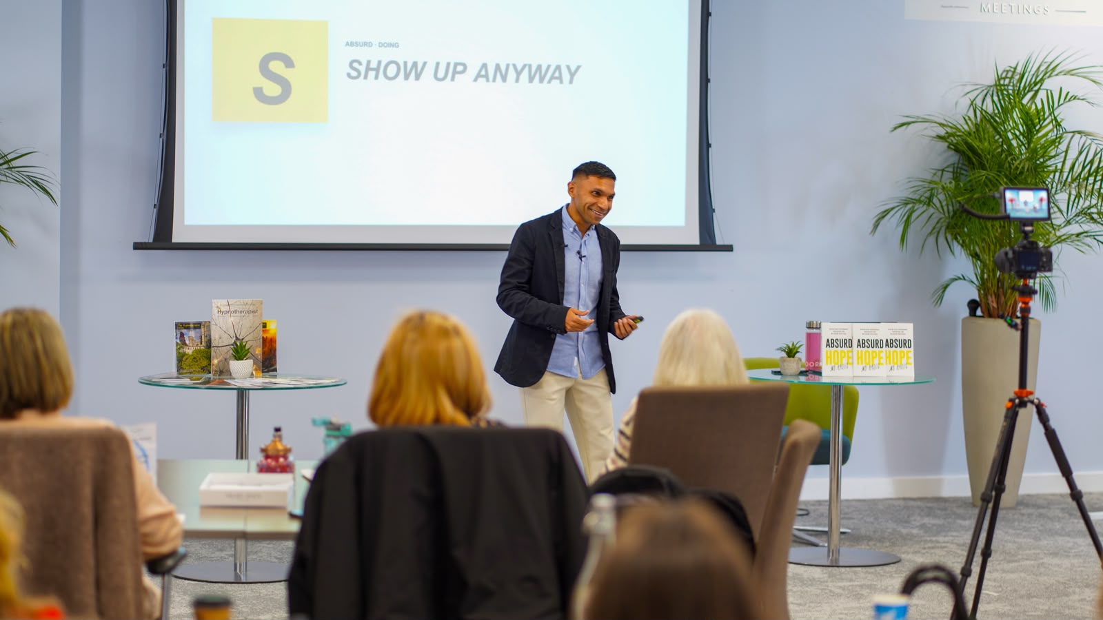 Mo Haque speaking to a live audience